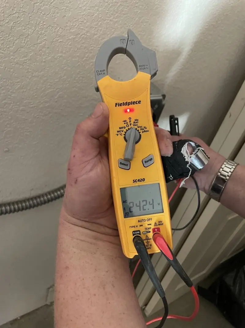 Voltage testing with clamp meter during Electrical Installation Services in El Monte